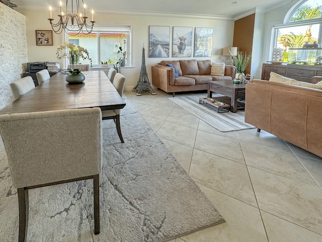 tiled dining space featuring crown molding and a chandelier