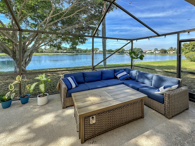 view of patio with a water view and outdoor lounge area