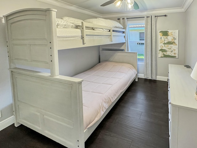 bedroom with crown molding, ceiling fan, and dark hardwood / wood-style flooring