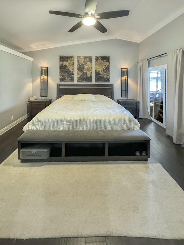 bedroom featuring vaulted ceiling, crown molding, ceiling fan, and dark hardwood / wood-style flooring