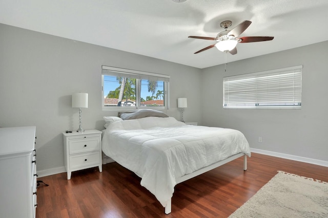 bedroom featuring ceiling fan and dark hardwood / wood-style flooring