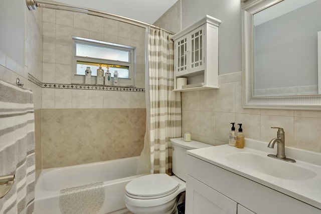 full bathroom featuring toilet, tasteful backsplash, tile walls, vanity, and shower / bath combination with curtain