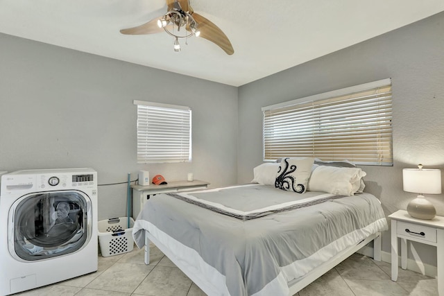 tiled bedroom with washer / clothes dryer and ceiling fan