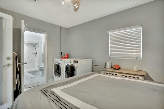 bedroom with separate washer and dryer and connected bathroom