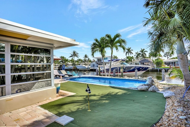 view of pool featuring a water view