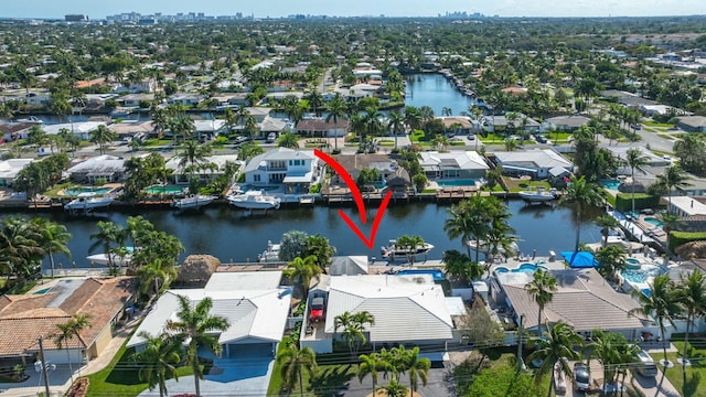 birds eye view of property with a water view