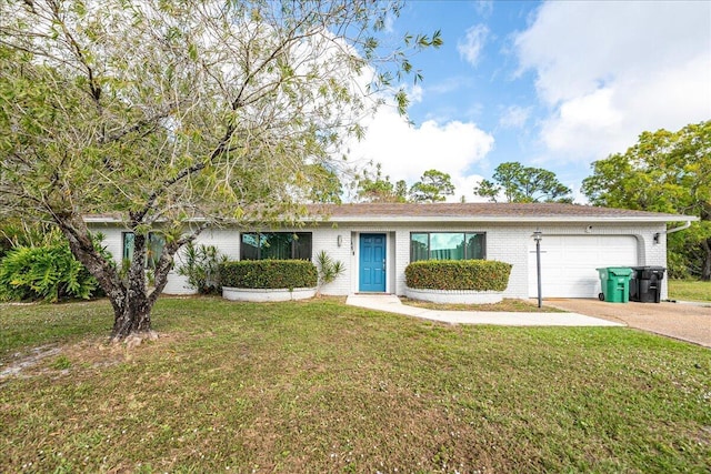 single story home with a garage and a front lawn