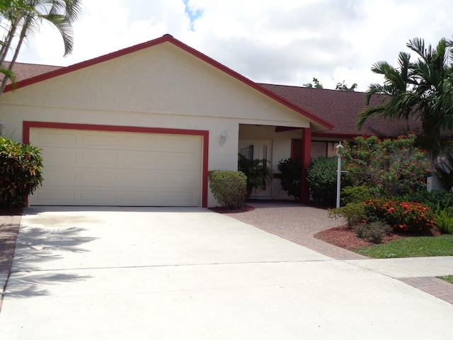 ranch-style home featuring a garage