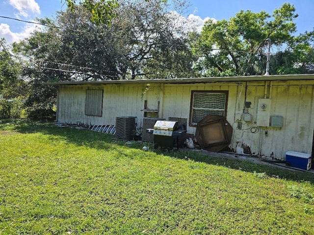 exterior space featuring a yard and central AC unit