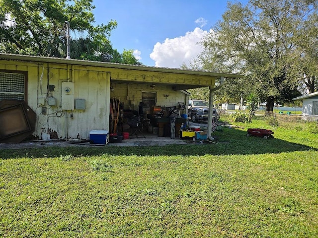 view of outdoor structure with a lawn