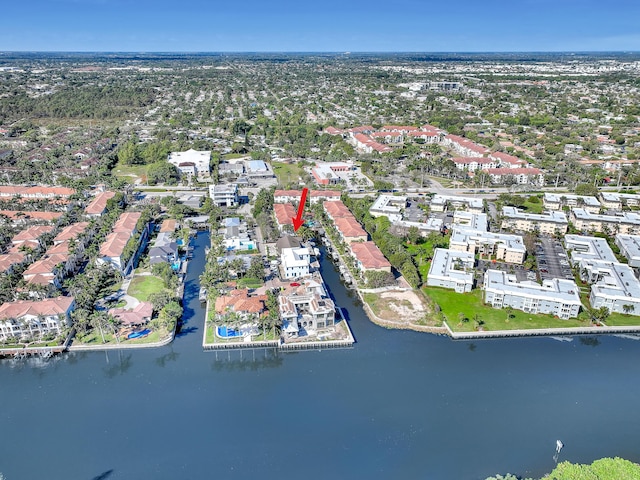 bird's eye view featuring a water view and a residential view