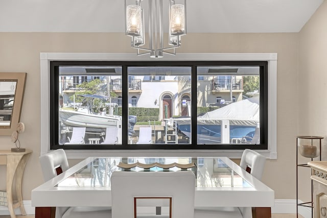 dining space featuring a chandelier