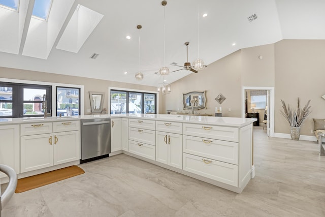 kitchen with a skylight, visible vents, white cabinets, open floor plan, and stainless steel dishwasher