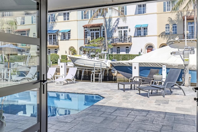 view of swimming pool with a patio area