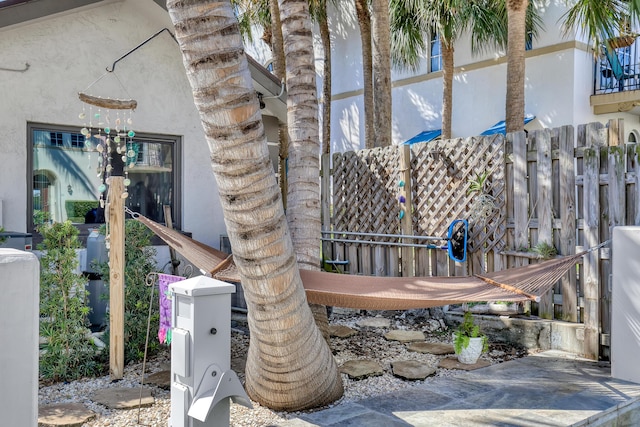 exterior space with fence and stucco siding