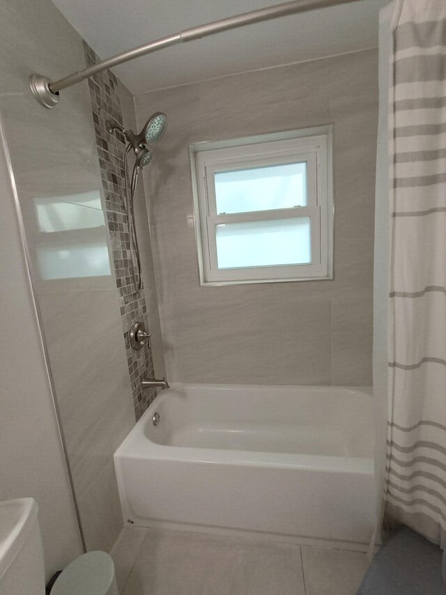 tiled bedroom with a skylight, access to outside, french doors, and ceiling fan