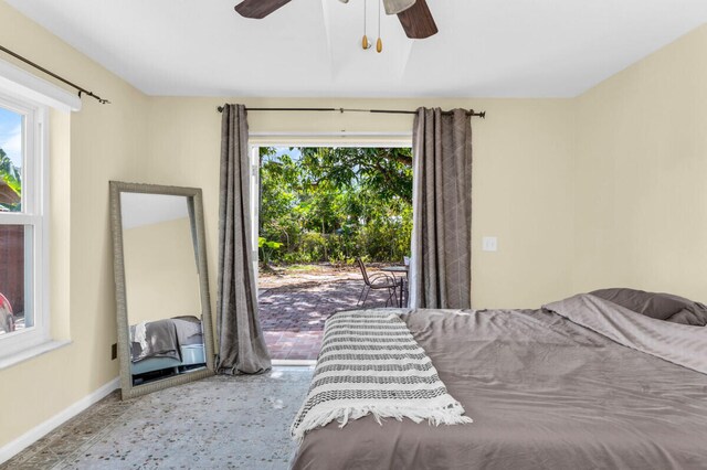 tiled bedroom featuring a closet and ceiling fan