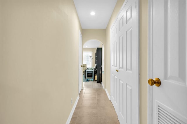 corridor featuring light tile patterned flooring