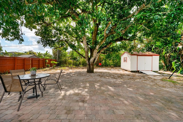 view of patio / terrace with a shed