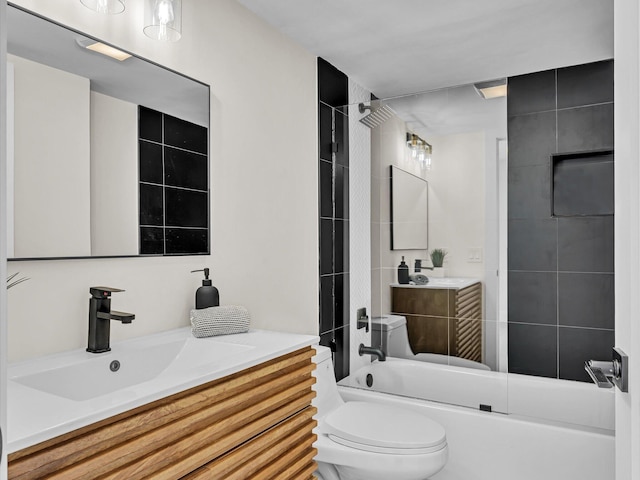 bathroom with shower / tub combination, vanity, and toilet