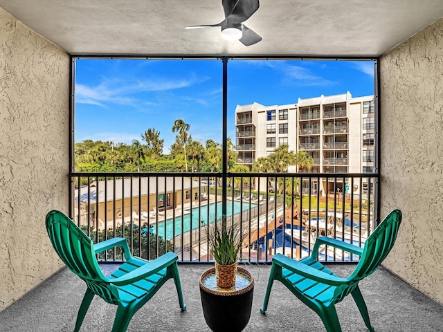 balcony featuring ceiling fan