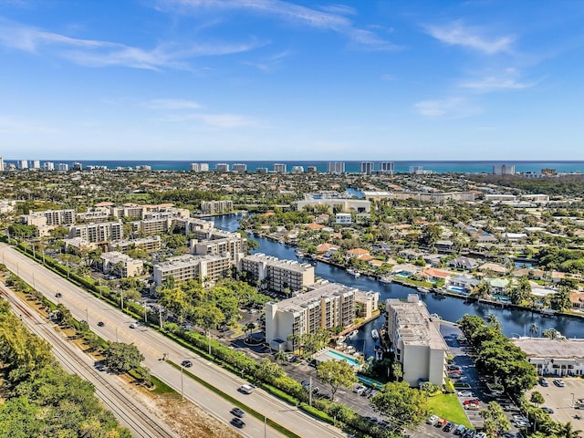 birds eye view of property with a view of city and a water view