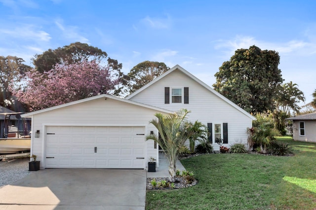 view of front of property with a garage and a front yard