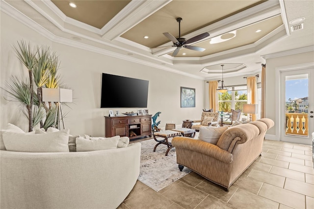 living room featuring a raised ceiling, crown molding, tile patterned flooring, and ceiling fan