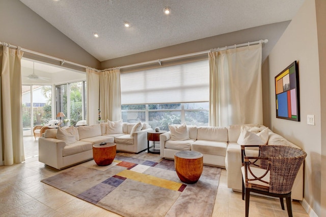 living room with vaulted ceiling and a textured ceiling