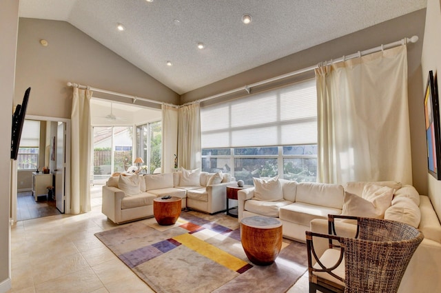 tiled living room with high vaulted ceiling and a textured ceiling