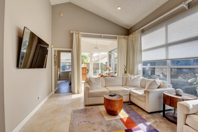 living room featuring light tile patterned floors, a textured ceiling, and high vaulted ceiling