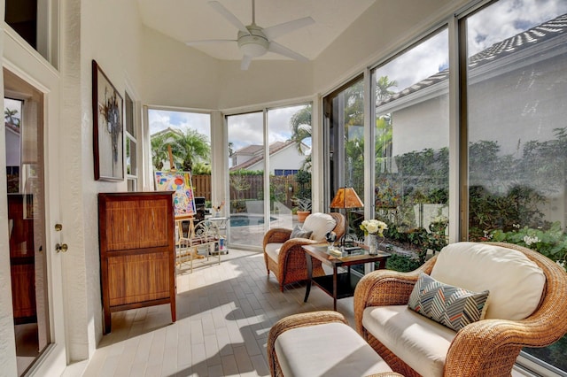 sunroom / solarium featuring vaulted ceiling and ceiling fan