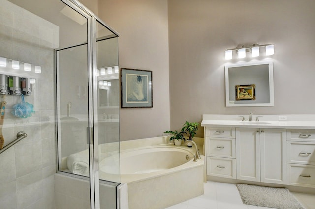 bathroom with tile patterned floors, vanity, and independent shower and bath