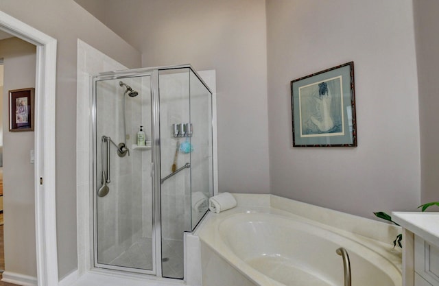 bathroom with shower with separate bathtub