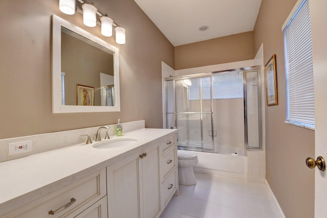 full bathroom with enclosed tub / shower combo, vanity, toilet, and tile patterned floors