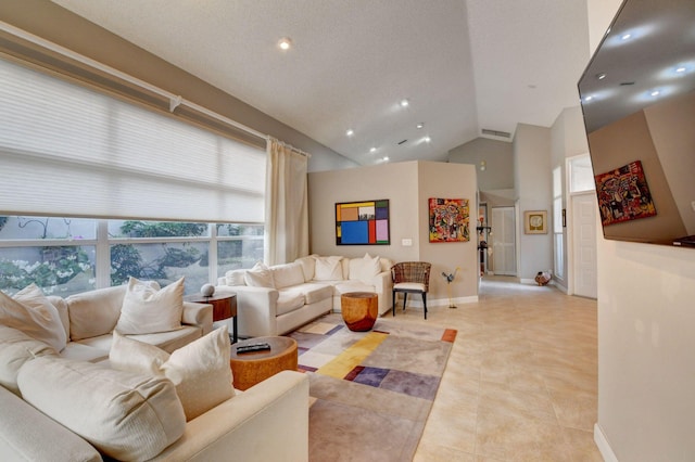 tiled living room featuring high vaulted ceiling