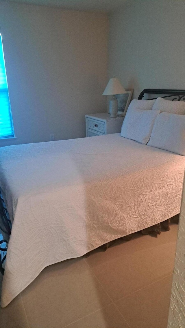 bedroom featuring tile patterned flooring