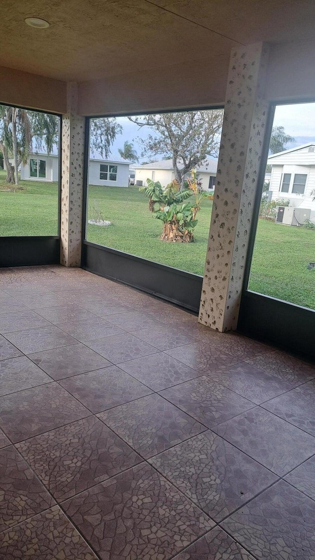 unfurnished sunroom with a wealth of natural light