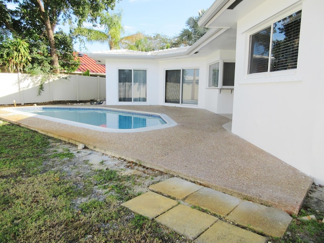 view of swimming pool with a patio