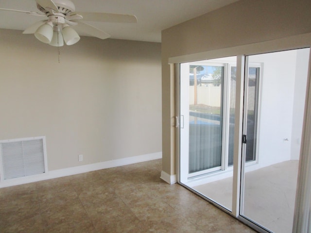 spare room with ceiling fan