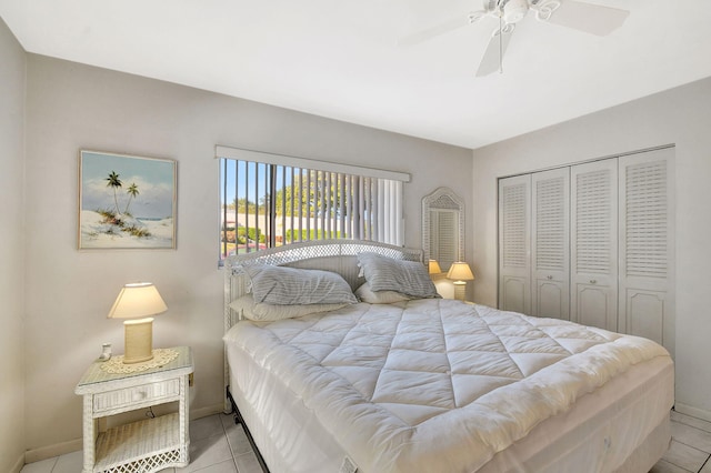 bedroom featuring a closet, ceiling fan, and light tile patterned flooring