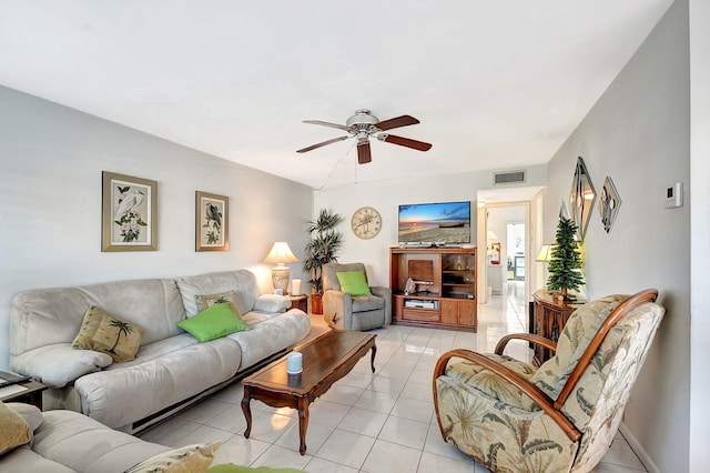 living room with light tile patterned floors and ceiling fan