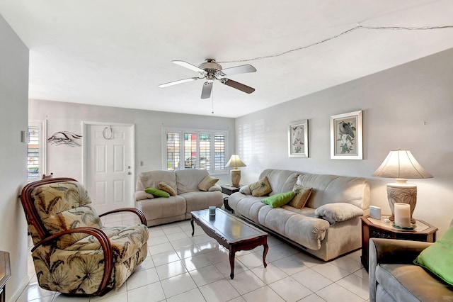 tiled living room with ceiling fan