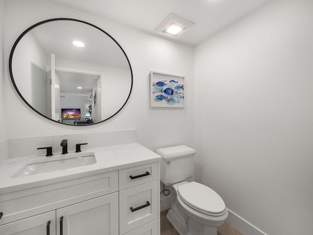 bathroom featuring vanity and toilet