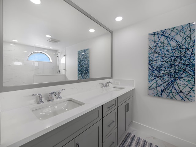 bathroom featuring vanity and a shower