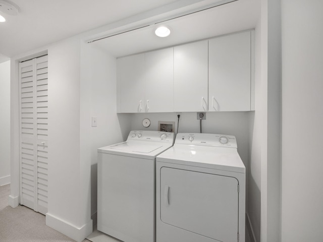 laundry area featuring cabinets and washer and dryer