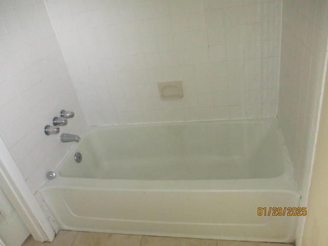 bathroom with tile patterned floors