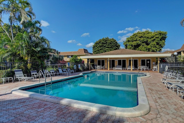 view of swimming pool with a patio area