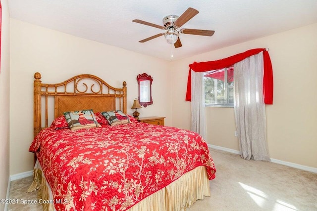 bedroom with light carpet and ceiling fan