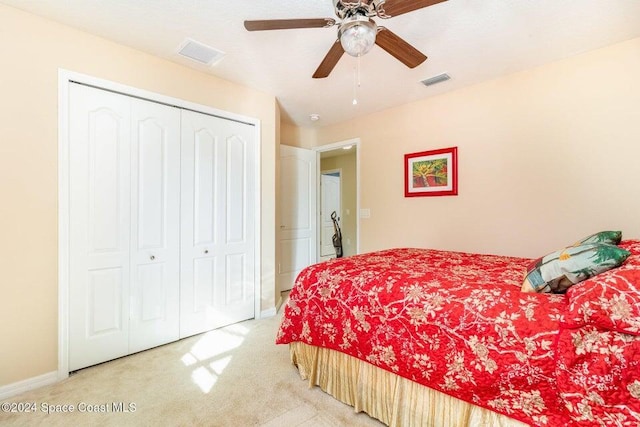 bedroom featuring carpet, ceiling fan, and a closet